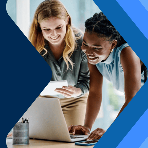 Two people collaborating at a desk, looking at a laptop and documents, with a geometric blue graphic framing the scene.
