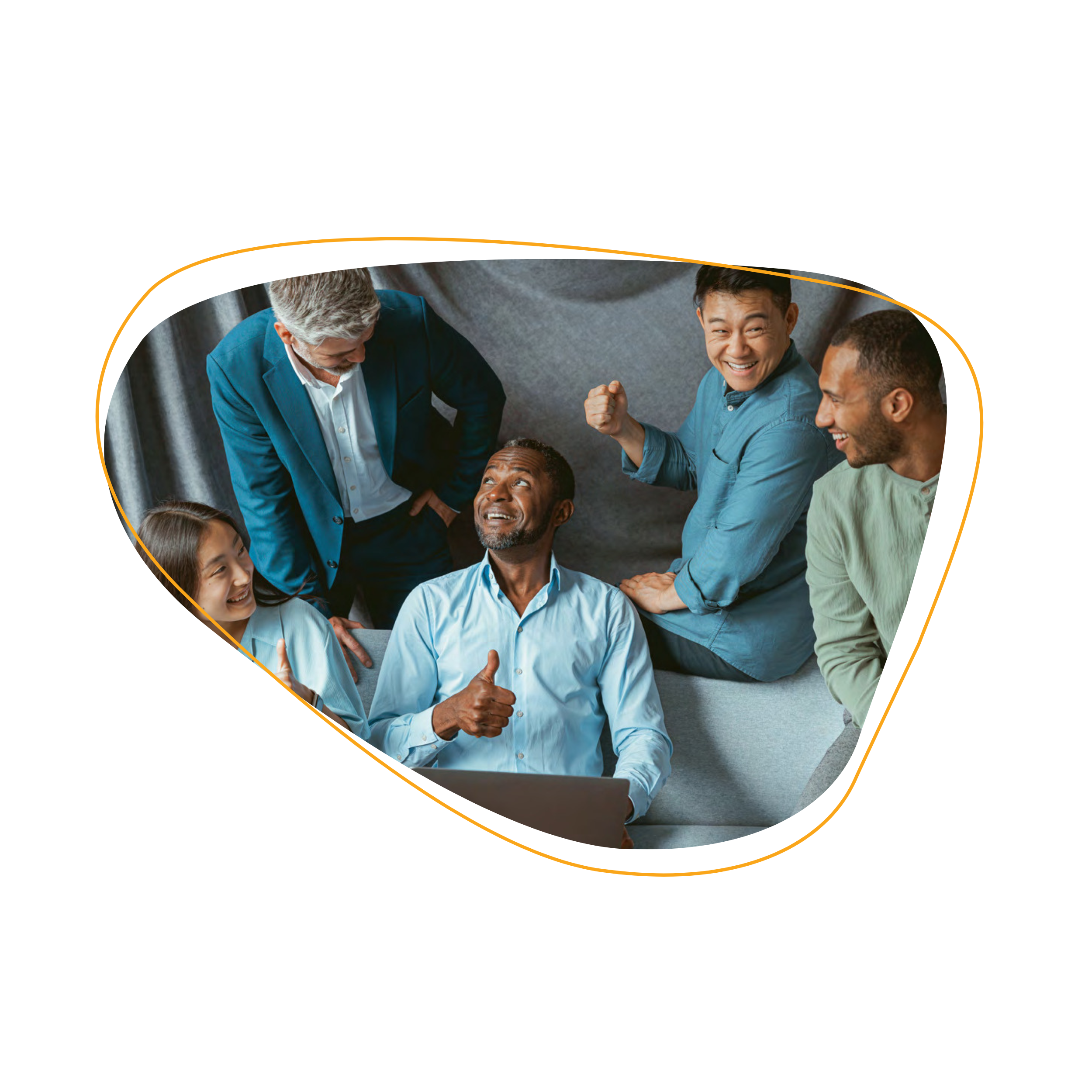 a group of co-workers smiling and chatting in the office