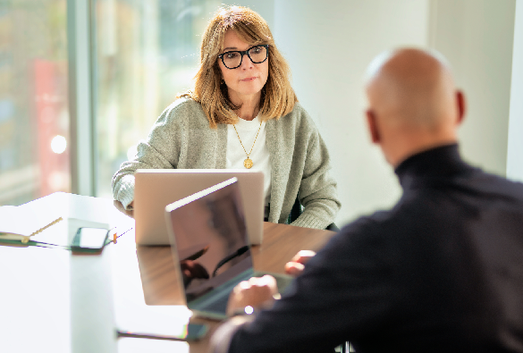 Professional discussion taking place in an office setting.