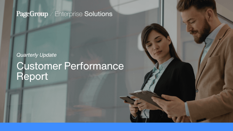 two coworkers looking a report next to the title: quarterly update, customer performance report