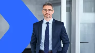 Man in a suit with his hands in his pockets
