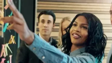 Team collaborating with sticky notes during a brainstorming session.