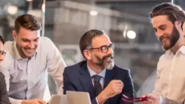 a group having a conversation in a luminous room 