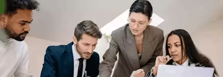 Team reviewing documents together at a workplace.